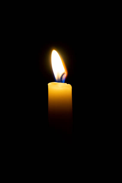 istock candle flame, burn isolated on black background 1150283101