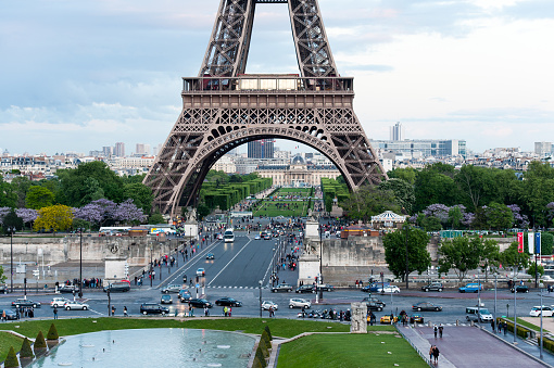 France, Paris - May 21, 2019: Eiffel Tower and Champ de Mars. Many cars and tourists