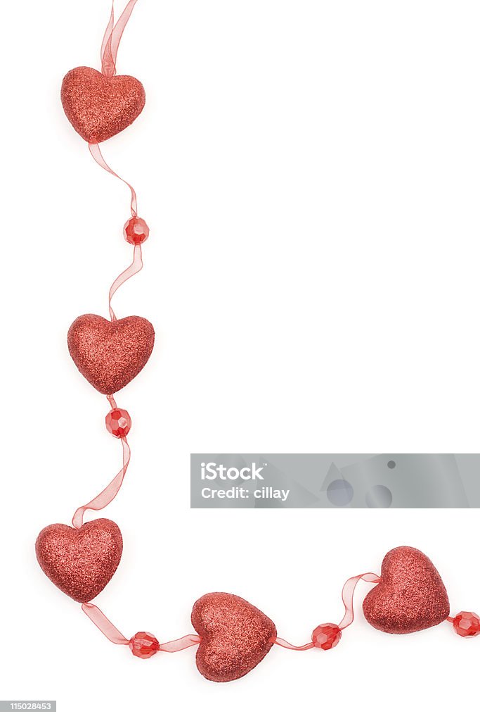 Red Heart Garland Red heart shape decoration on a white background. Border - Frame Stock Photo