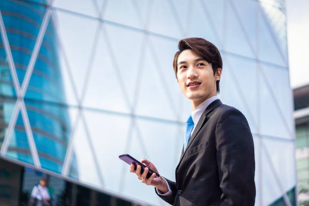 istock Asian businessman with his smartphone 1150284957