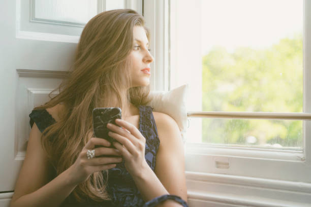 istock Beautiful Woman Checking Her Phone 1150286088