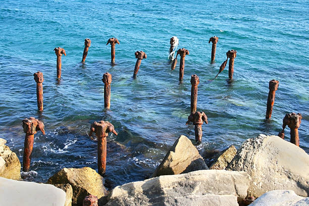 istock Sea water and broken pier 115028758