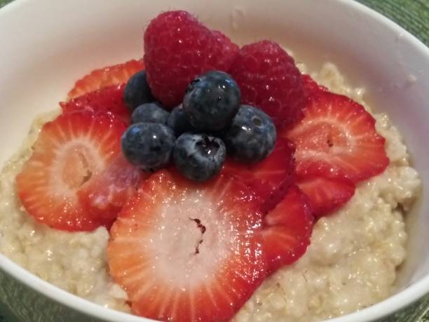 istock Oatmeal breakfast - Mixed berries oatmeal - healthy breakfast - no cholesterol 1150288881