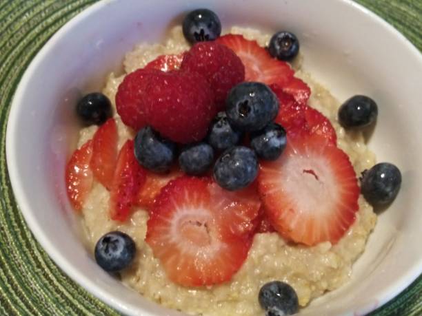 istock Oatmeal breakfast - Mixed berries oatmeal - healthy breakfast - no cholesterol 1150288906