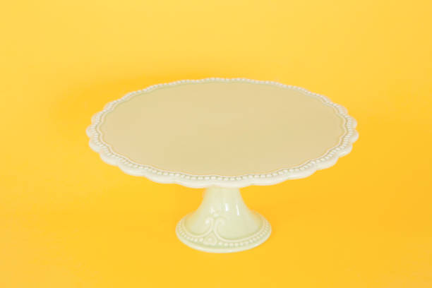 Vintage cake stand Vintage cake stand on yellow background serving dish stock pictures, royalty-free photos & images