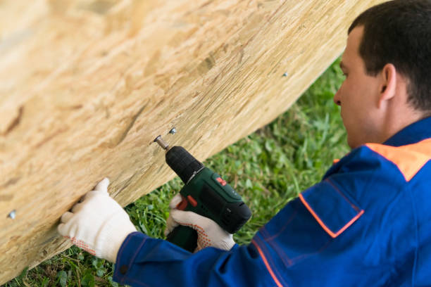 worker's hands screwed a wooden shield with a screwdriver, close-up top view worker's hands screwed a wooden shield with a screwdriver, close-up top view work tool nail wood construction stock pictures, royalty-free photos & images