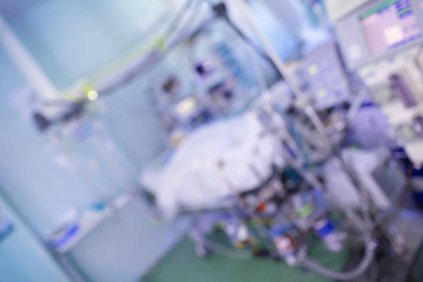 istock Patient in the intensive care unit connected to the electronic systems of life support, unfocused background 1150292801