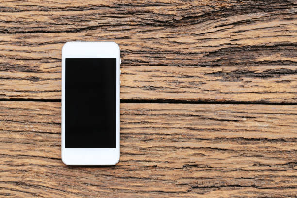 istock Empty Smartphone on brown wooden floor and have copy space. 1150293138