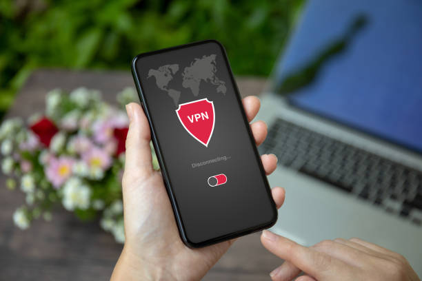 istock female hand holding phone with app vpn private network 1150295850