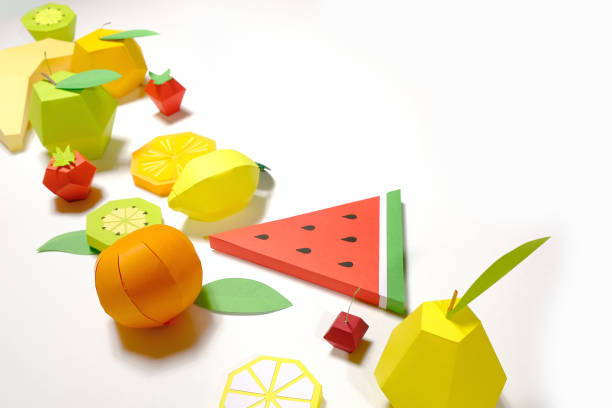 istock exotic fruit made of paper on white background. 1150297074