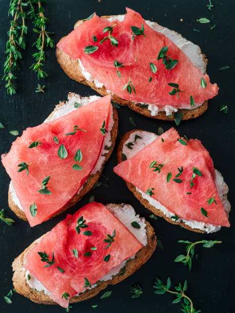 istock Toasts with watermelon, soft cheese and thyme 1150297525