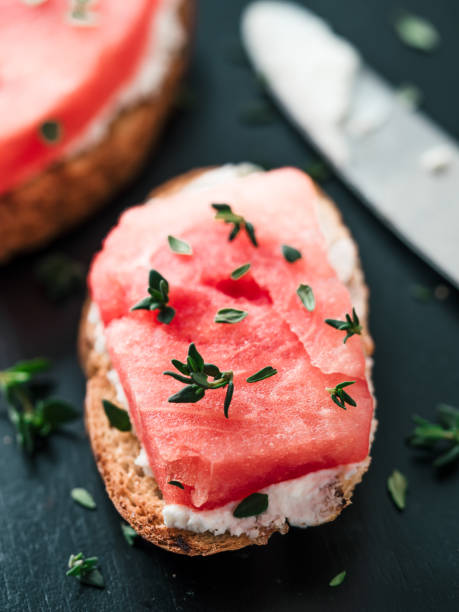 istock Toasts with watermelon, soft cheese and thyme 1150297552