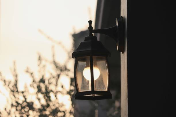 istock retro style wall lamp with light bokeh in evening  background 1150297585