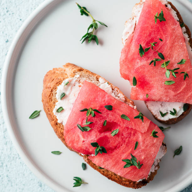 istock Toasts with watermelon, soft cheese and thyme 1150297587