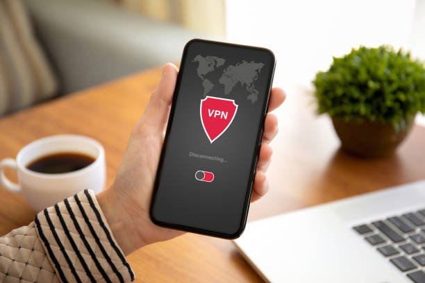 istock female hands holding phone with app vpn private network 1150297870