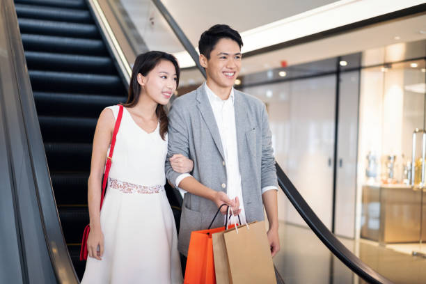 istock Young couple on an escalator 1150298803
