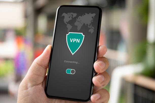 istock man hand holding phone with app vpn private network 1150299309