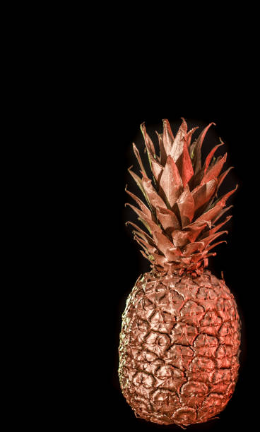 istock Golden pineapple on black isolated background creative and art 1150299566