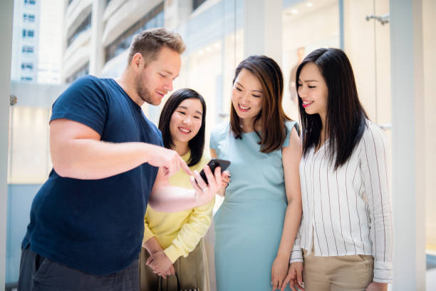 istock Caucasian man asking Asian women for direction 1150299854