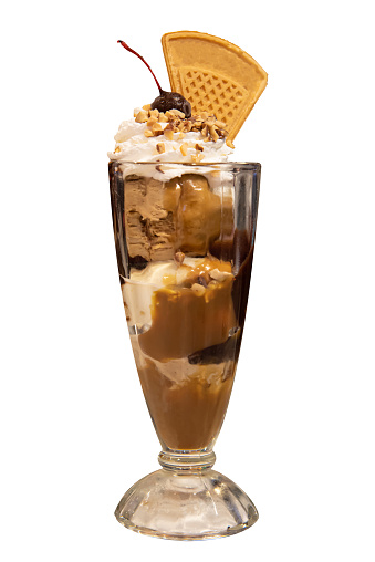 Ice cream parfait sundae in glasses with whip cream and wafer on top
