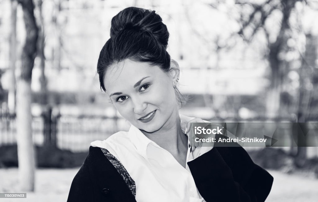 Black and white portrait of a beautiful woman. Black and white portrait of a beautiful woman in a city Park. Adult Stock Photo