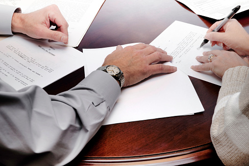 Businessman Preparing reports papers. Piles of unfinished document achieves with paper clip. Concept of Business Annual Report.