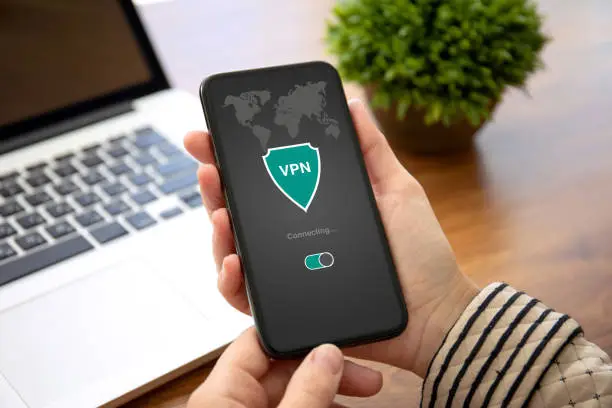 Photo of woman hands holding phone with app vpn private network
