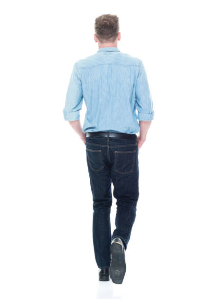 istock Handsome man with hands in pocket and walking 1150303470
