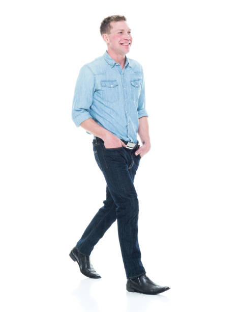 istock Handsome man with hands in pocket and walking 1150303554