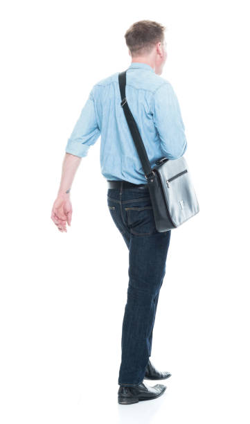 istock Rear view of man walking with a shoulder bag 1150303592