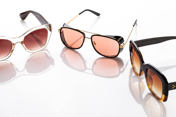 different fashion sunglasses on a white background.