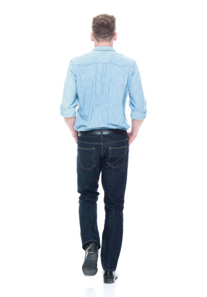 istock Handsome man with hands in pocket and walking 1150303693