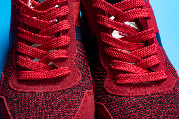istock laces on red fabric sneakers. close-up. 1150304311