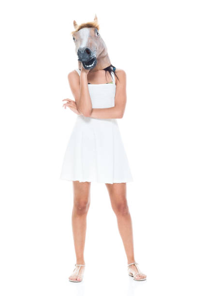 istock Cute female wearing a horse head 1150306249