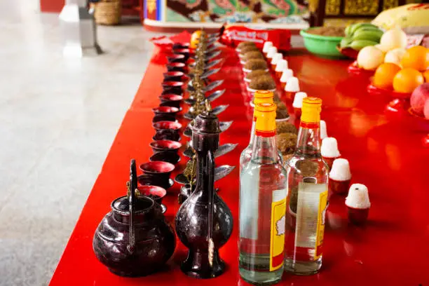 Sacrificial offerings and rice whisky alcohol for chinese people pray god and memorial to ancestor in Tiantan temple at Shantou or Swatow on May 7, 2018 in Chaozhou, China