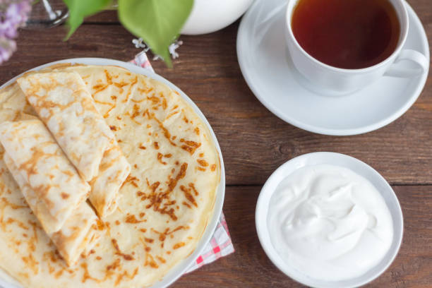 istock delicate pancakes with Breakfast cheese on a wooden background,top view 1150310870