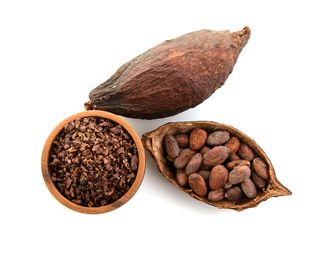Cocoa pods and cocoa beans and cacao powder with leaves isolated on white background.