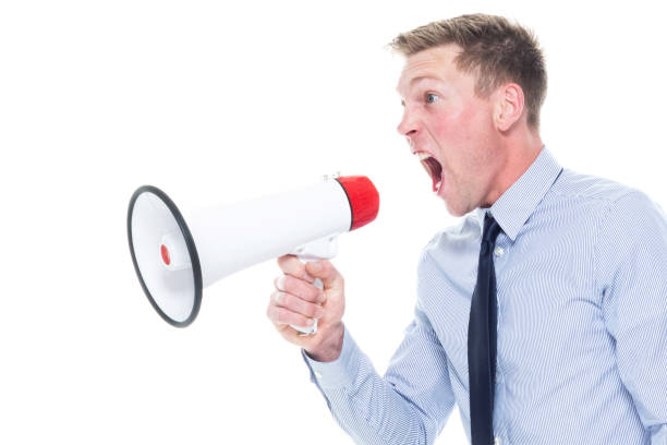 istock Handsome caucasian businessman in nice clothing - using a megaphone 1150311261