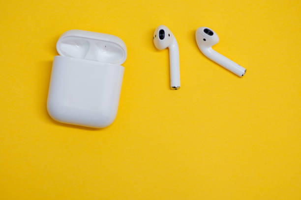 istock wireless earphones isolated against yellow background 1150311508