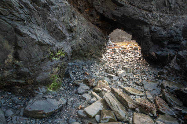istock low tide exposes a sea cave 1150312800