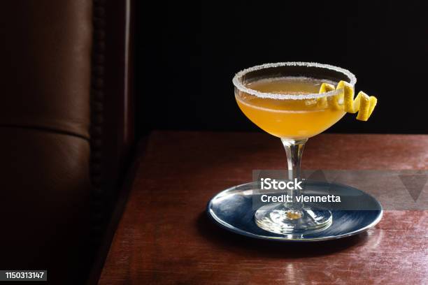 Sidecar Cocktail Served Up With Sugared Rim In Dark Luxurious Bar Stock Photo - Download Image Now