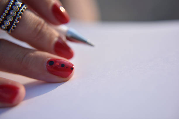 Closeup of a man writing on white paper