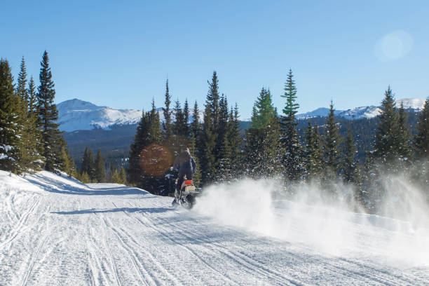 istock snowmobile man rider in mountain 1150315465