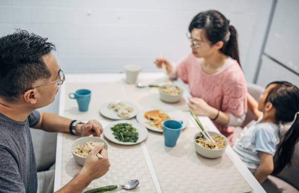istock Happy Family Having Meal Together 1150316782