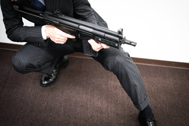 businessman to fight with a machine gun - 15828 imagens e fotografias de stock