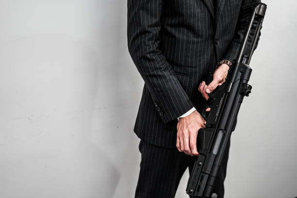 istock Businessman to fight with a machine gun 1150317836