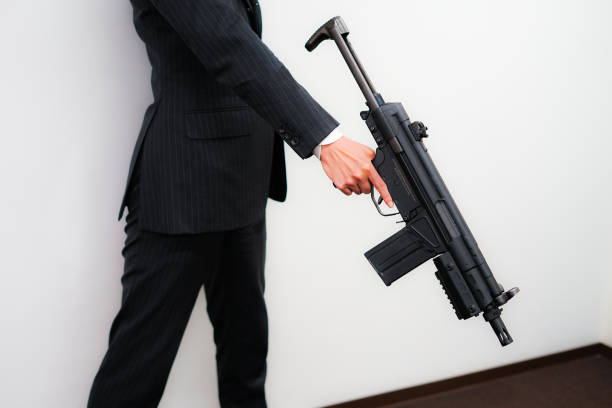 businessman to fight with a machine gun - 15855 imagens e fotografias de stock