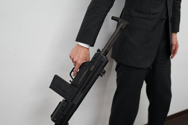 businessman to fight with a machine gun - 15851 imagens e fotografias de stock