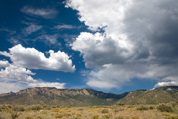 istock Dramatic Cumulus Clouds Over Sandia  Mountains in New Mexico 115031902