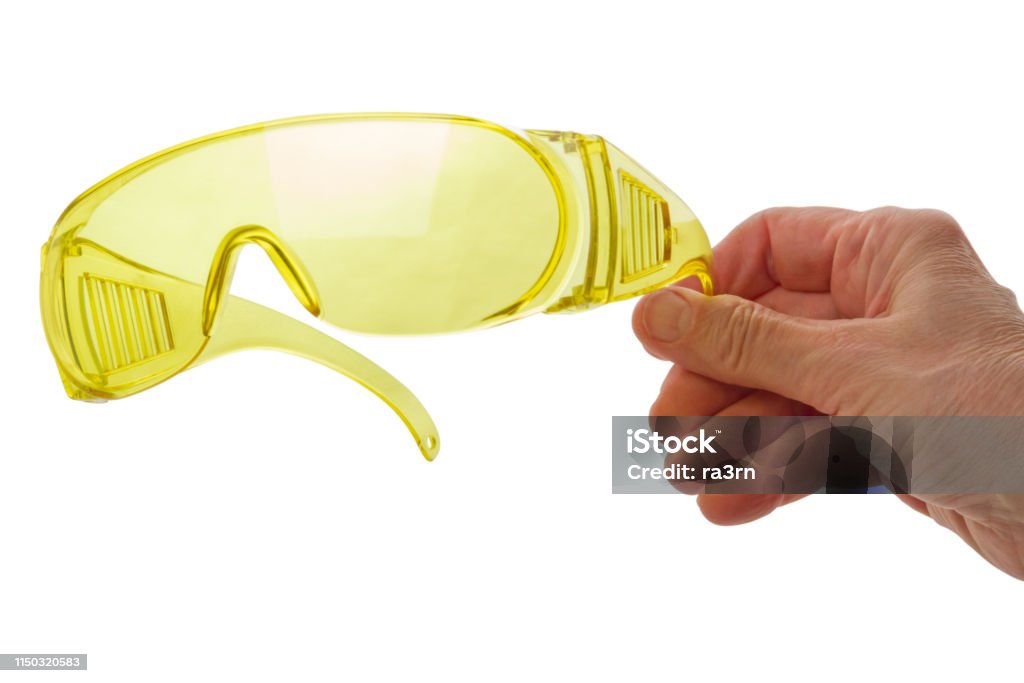 プラスチック製の安全メガネを使った手 - 1人のロイヤリティフリーストックフォト